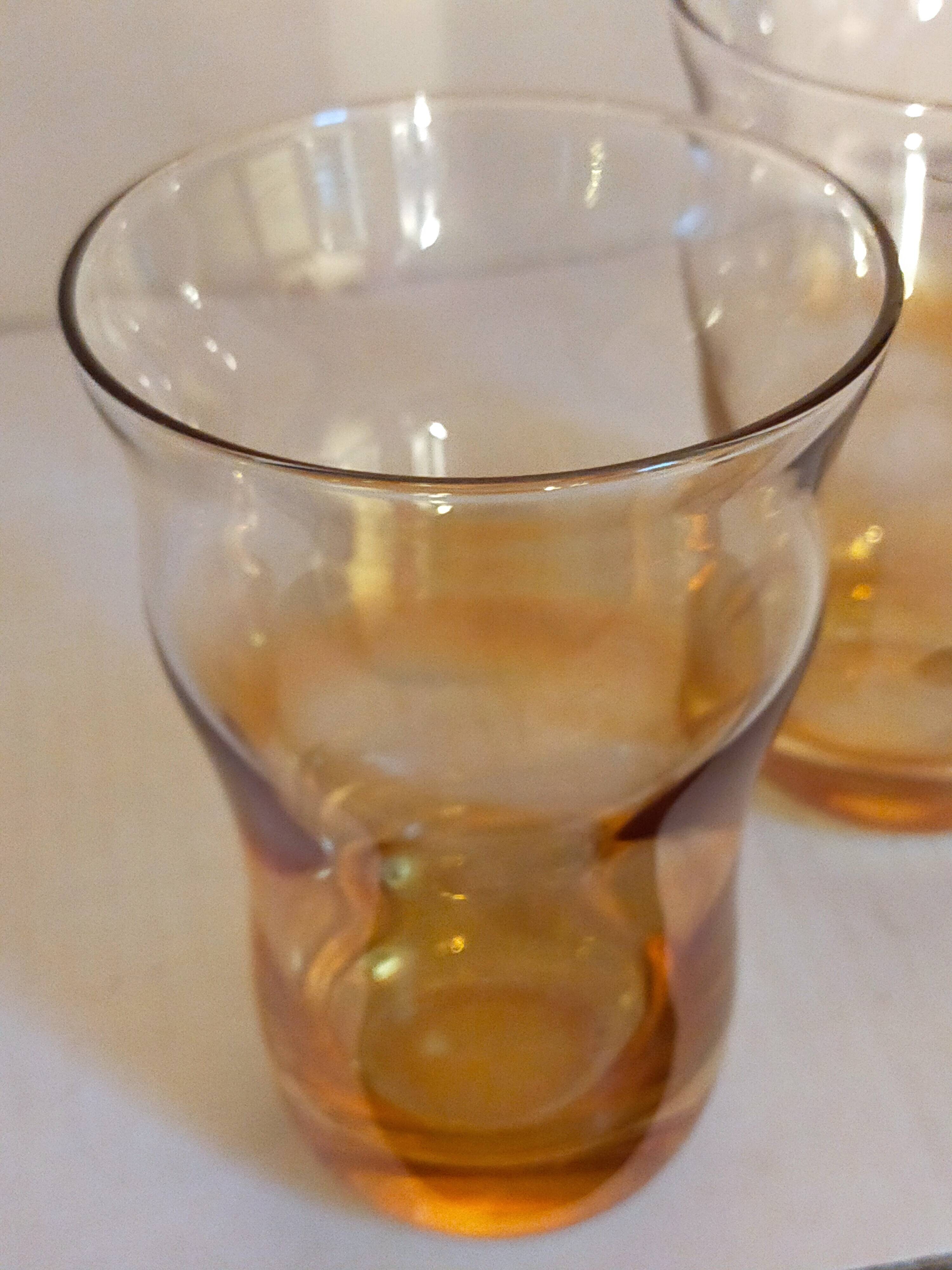 Four iridescent honey blown glass glasses