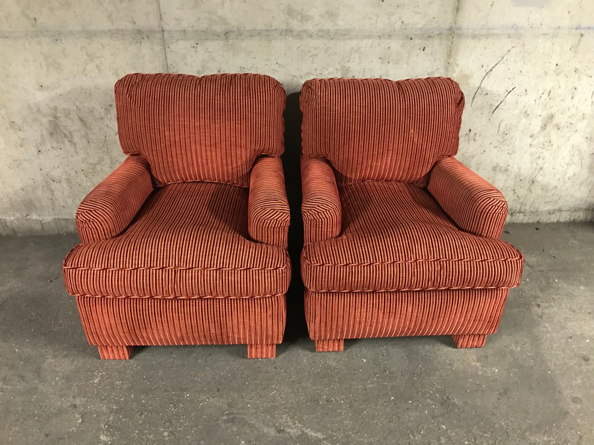 Pair of club in red velvet armchairs Yves Halard