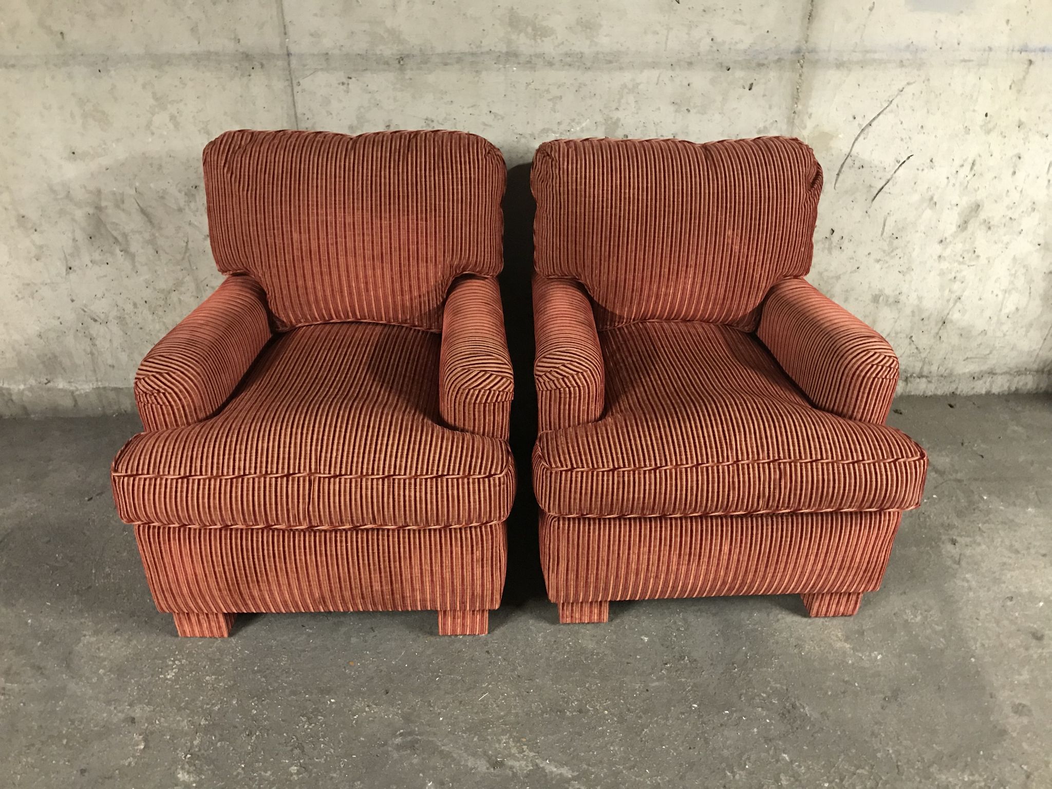 Pair of club in red velvet armchairs Yves Halard