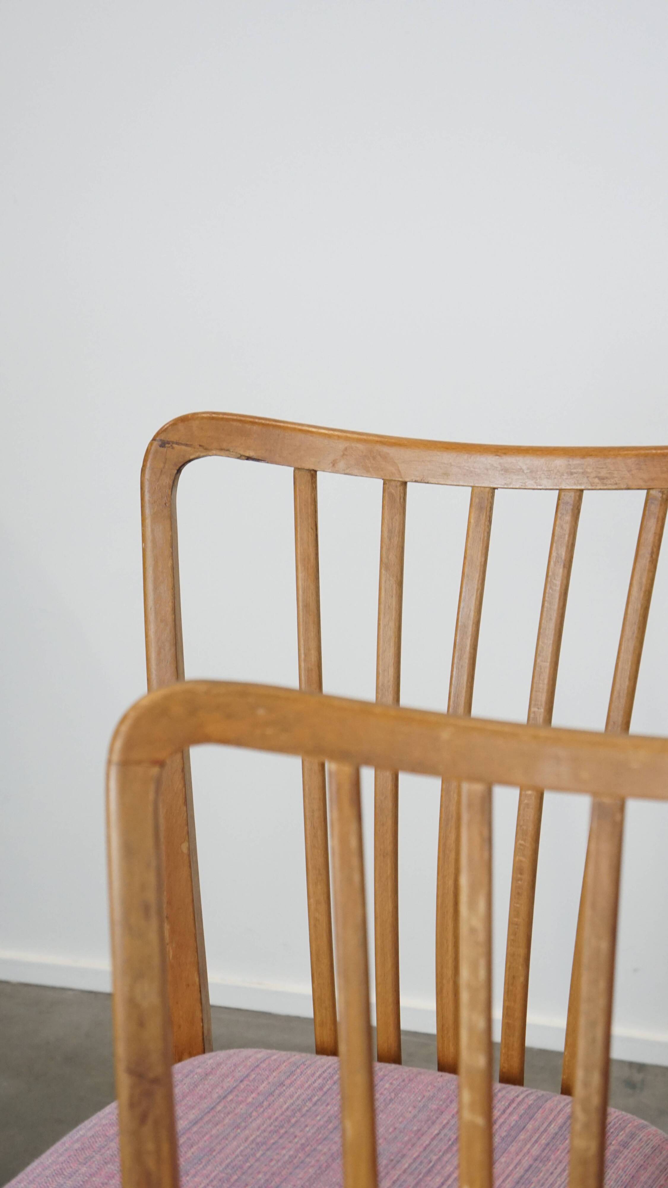 Set of 8 vintage Danish design dining chairs from the 1970s with light purple fabric seats