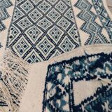 White and blue hand-woven rug in natural wool