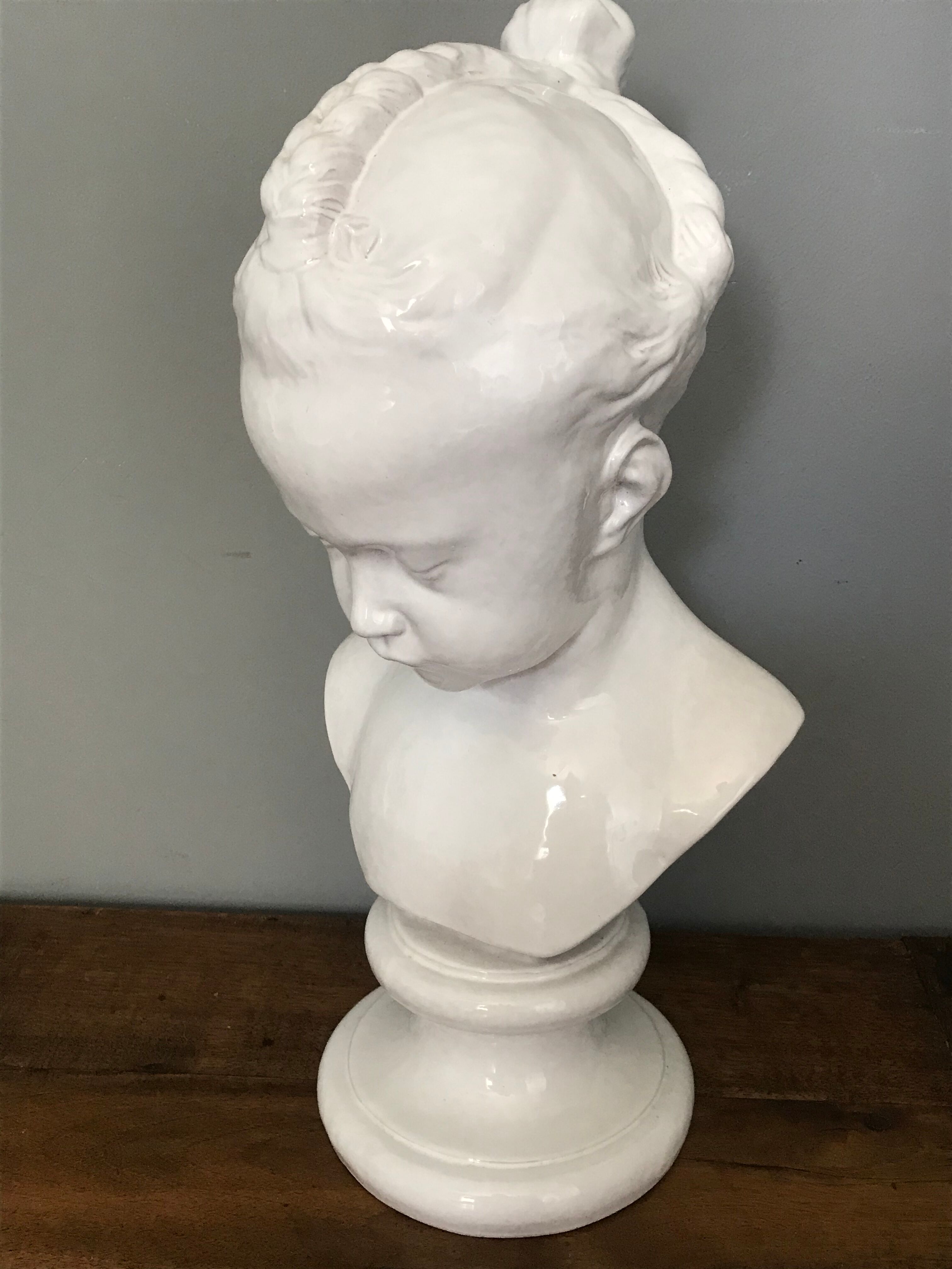 Child bust in enamelled terracotta