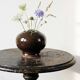 Brown and green glazed stoneware flower holder, vintage craftsmanship from the 1970s-1980s.