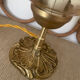 2 bedside lamps with round amber glass globes and gold metal.