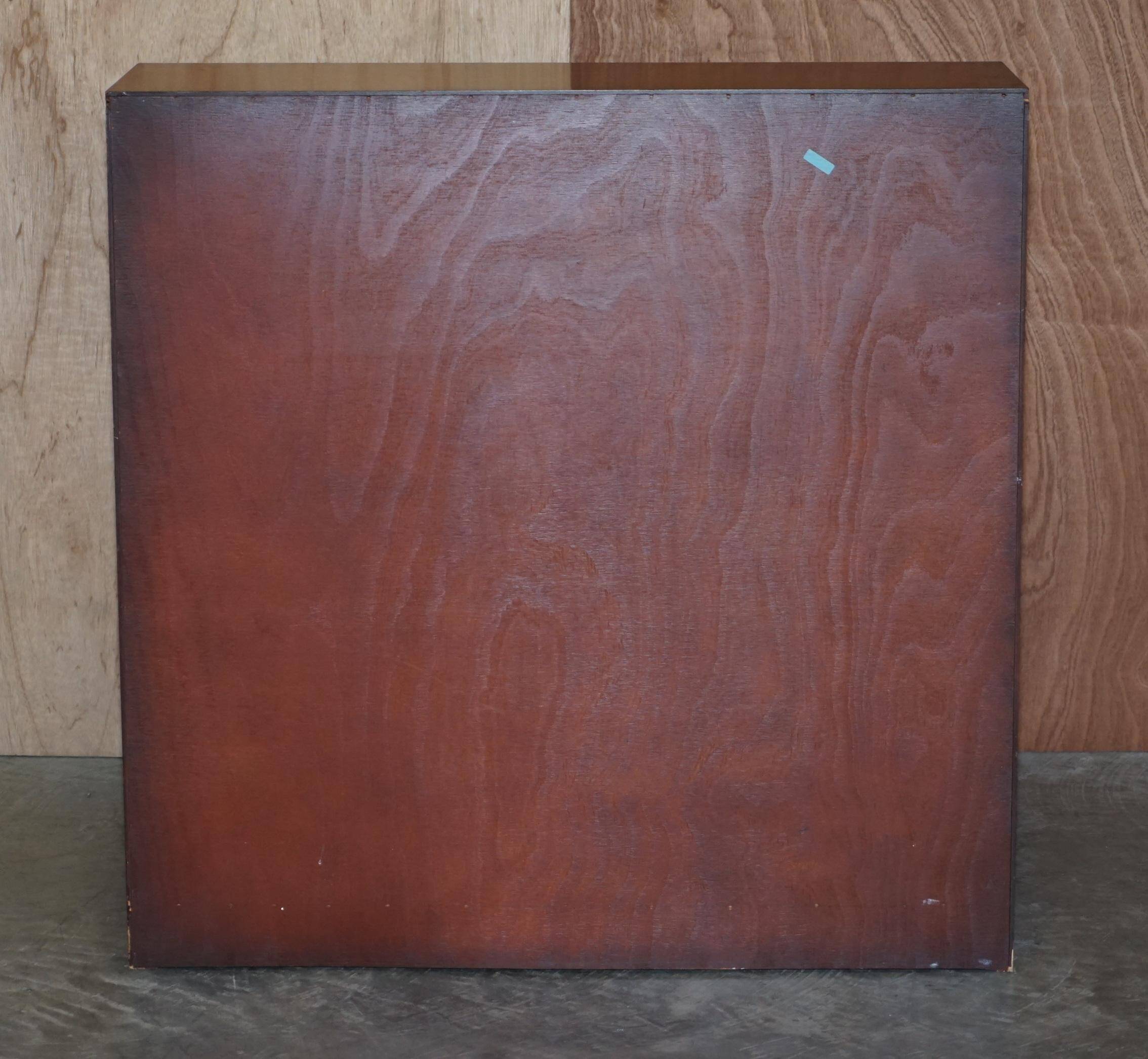 Pair of open dwarf bookshelves in mahogany by Shaws of London.