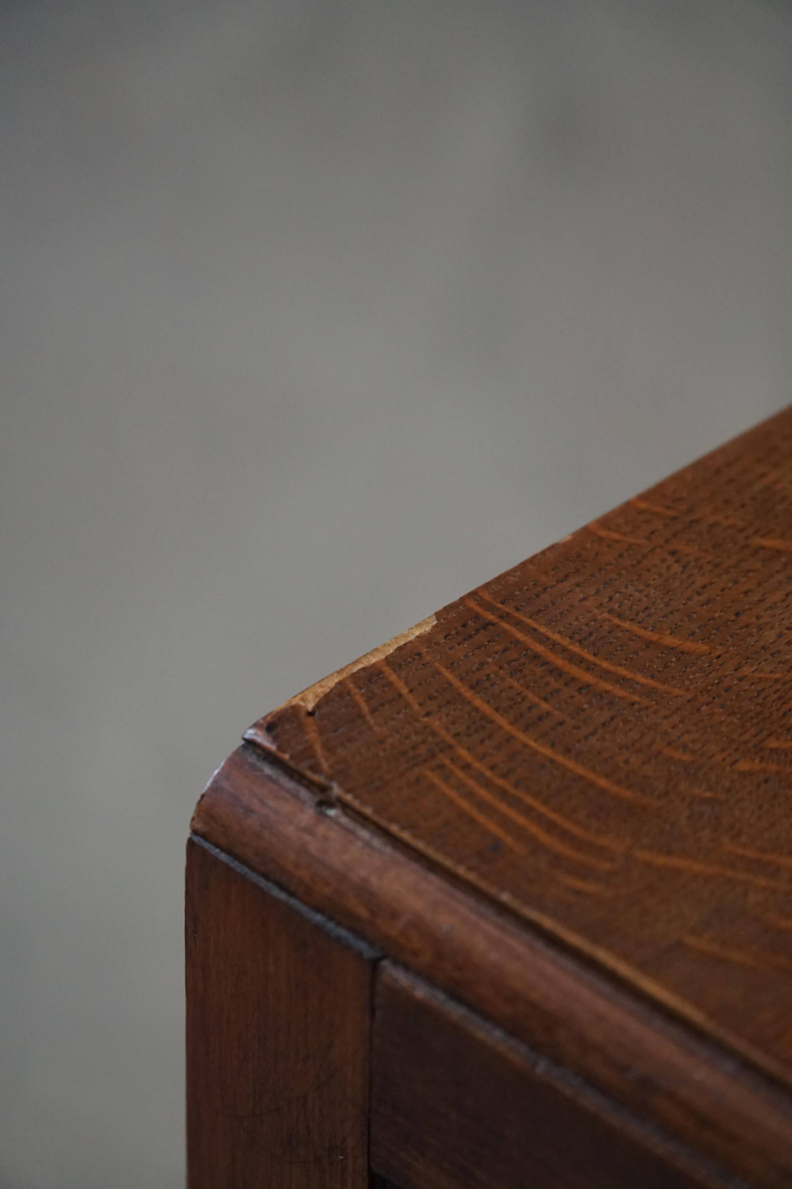 Desk / Chest of drawers in modern Danish oak from the early 20th century with shell handles.