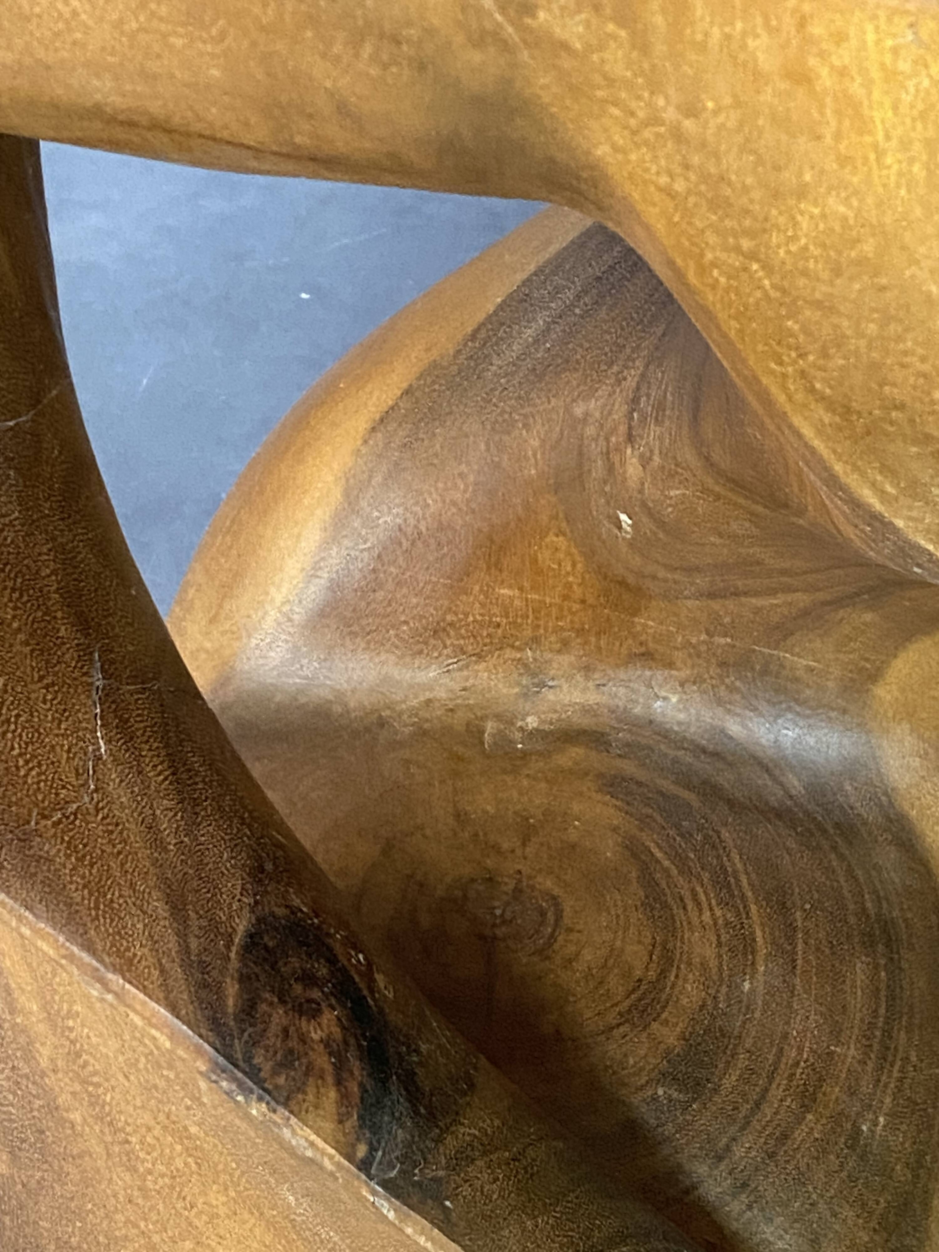 Stool n2 in solid raw walnut wood carved from the mass 1970
