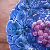Blue slip plate decorated with a bunch of Sarreguemines grapes
