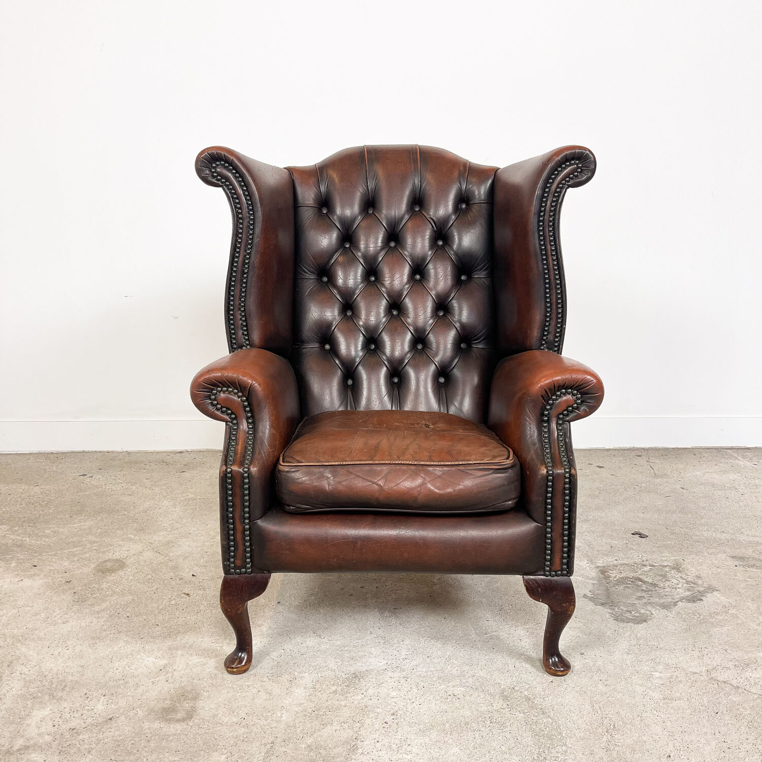Vintage rustic dark brown leather chesterfield wingback armchair wassenaar