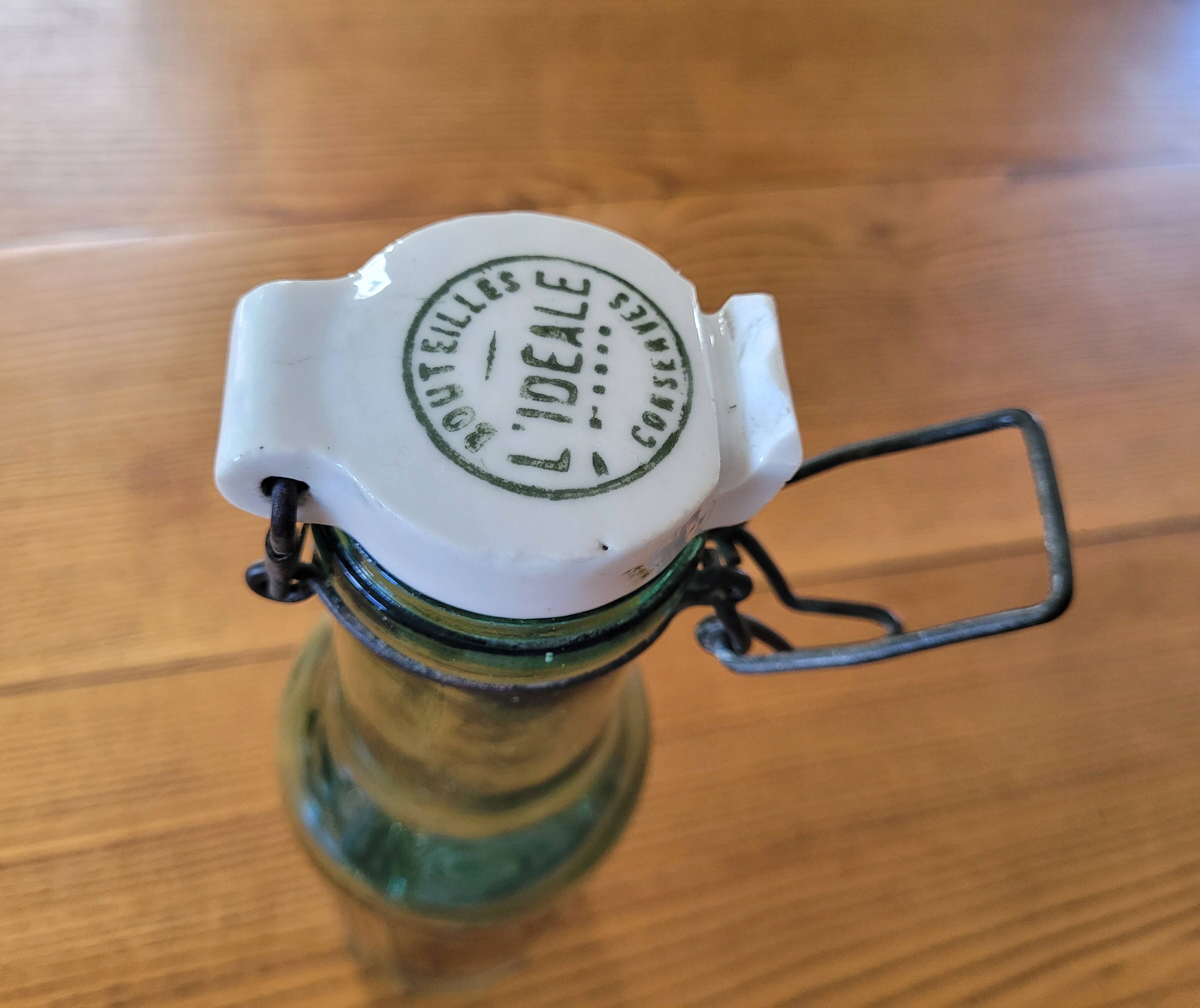 Vintage glass bottle l'Idéale with porcelain stopper