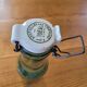 Vintage glass bottle l'Idéale with porcelain stopper