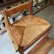 High chair made of wood and straw.