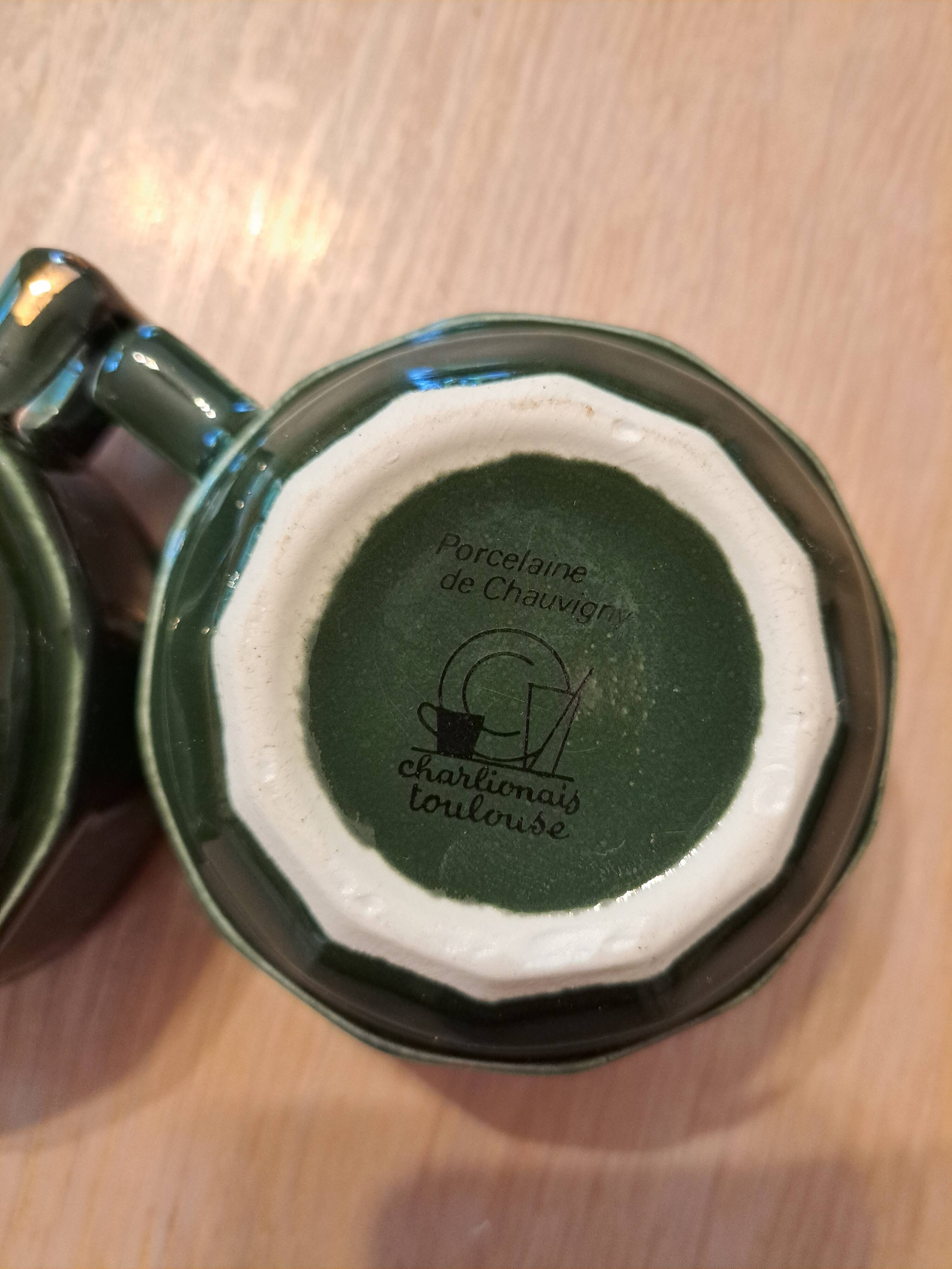 Green and gold coffee cups and sub-cups