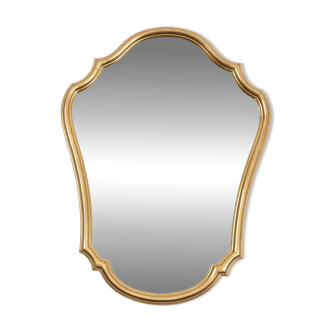 Old mirror gilded with gold leaf.