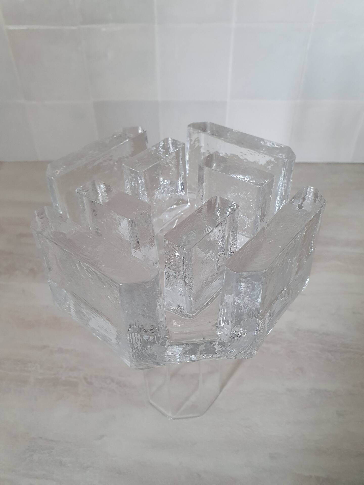 Candle holder or glass warmer with irregular ice effect.