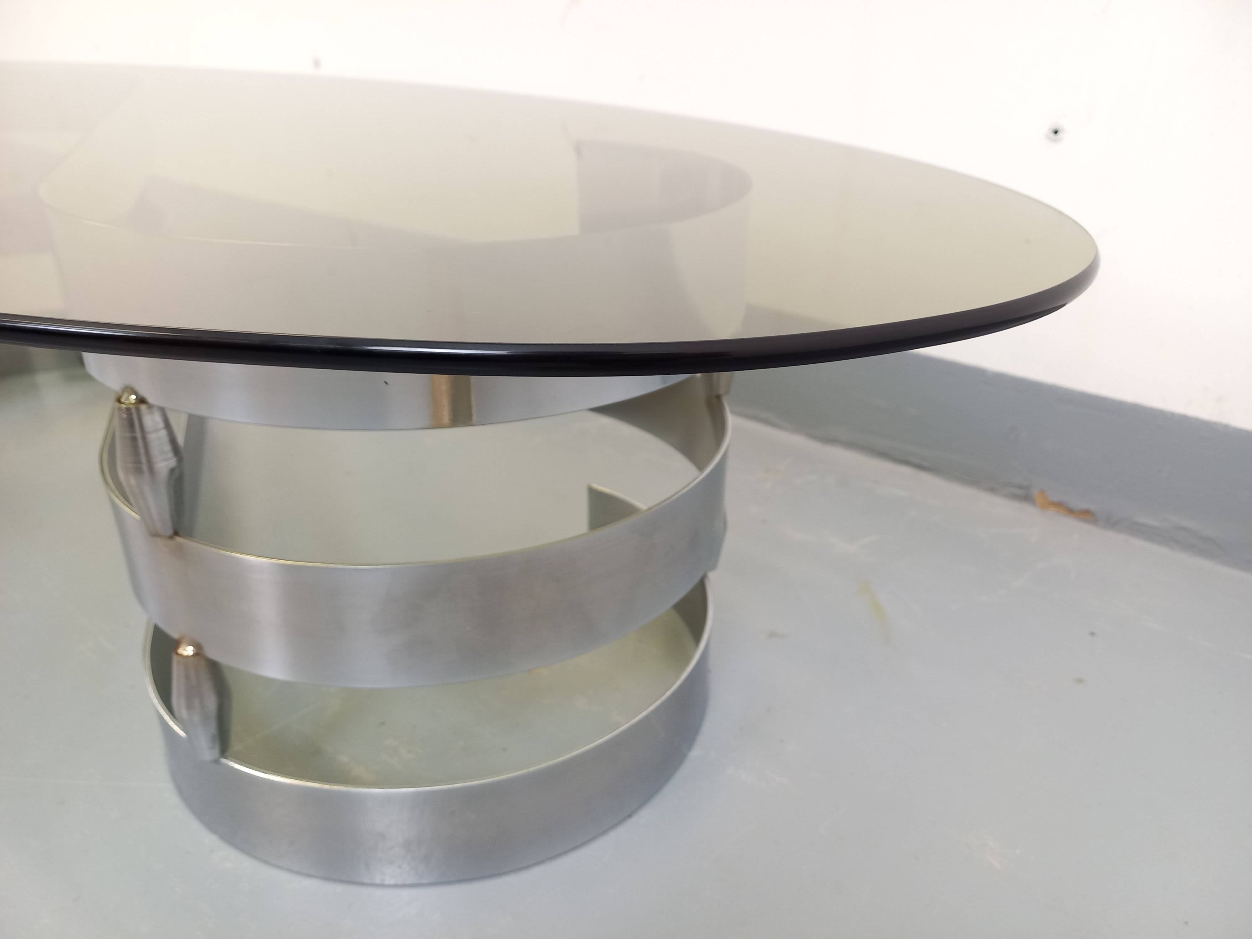 Vintage oval coffee table in smoked glass and chrome metal from the 1970s.