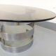 Vintage oval coffee table in smoked glass and chrome metal from the 1970s.