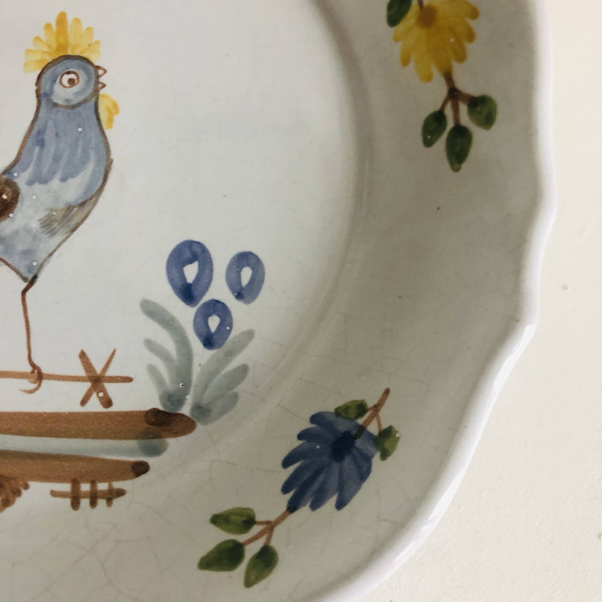 Pair of plates with naive Eastern rooster decoration