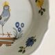 Pair of plates with naive Eastern rooster decoration