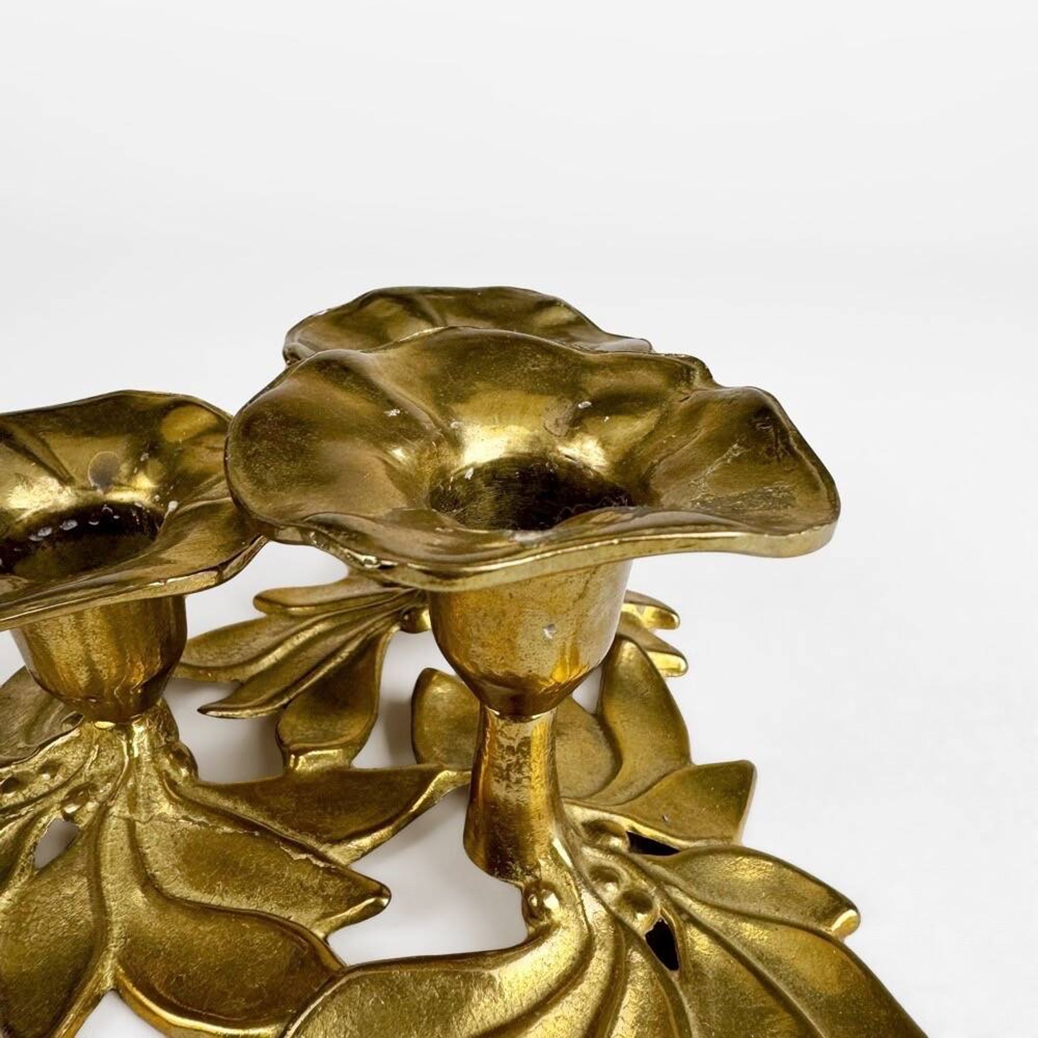 Art Nouveau style three-flower brass candle holder