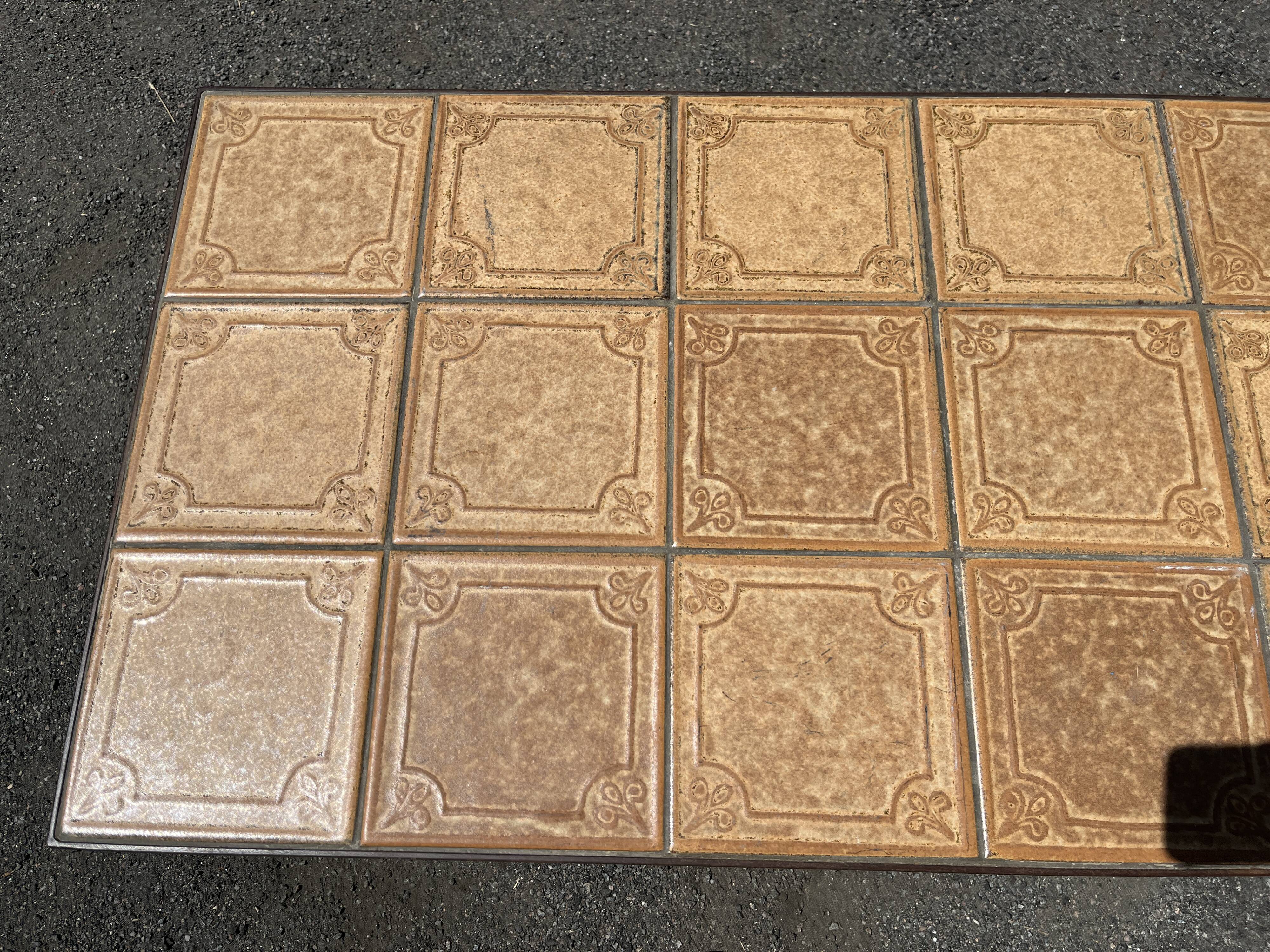 Vintage garden table with ceramic tile top and wrought iron base