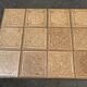 Vintage garden table with ceramic tile top and wrought iron base
