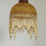 Vintage French amber mottled glass hanging ceiling light with beaded fringe.