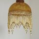 Vintage French amber mottled glass hanging ceiling light with beaded fringe.