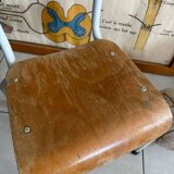 Old wooden and metal children's school chair