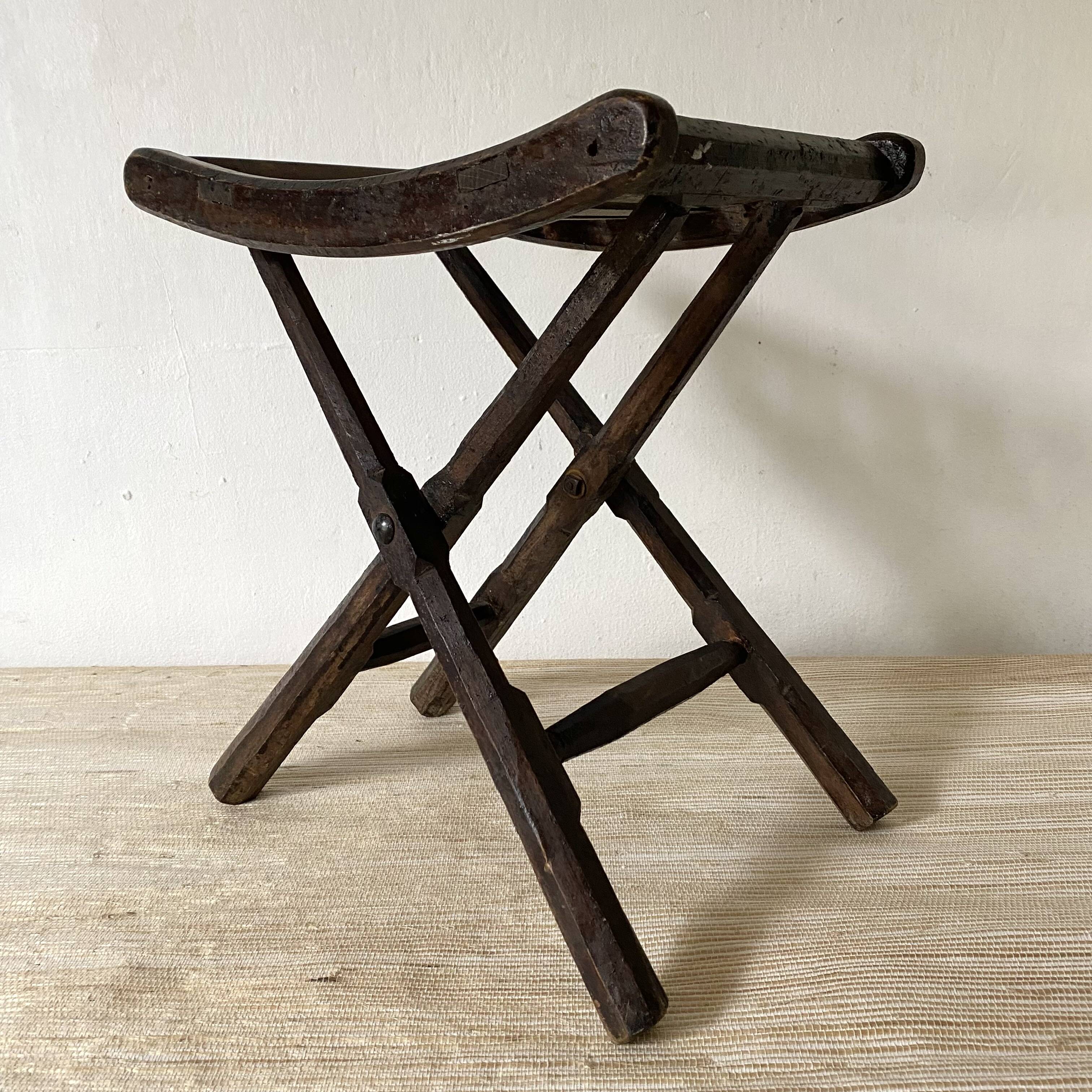 Folding slatted wooden stool