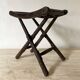 Folding slatted wooden stool