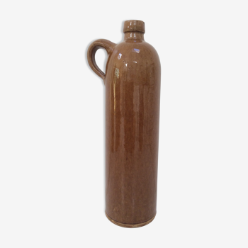 Old bottle in sandstone glossy with cove