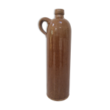 Old bottle in sandstone glossy with cove