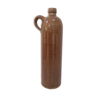 Old bottle in sandstone glossy with cove