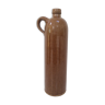 Old bottle in sandstone glossy with cove