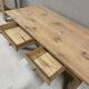 Large solid wood table with a sleek design – integrated storage.