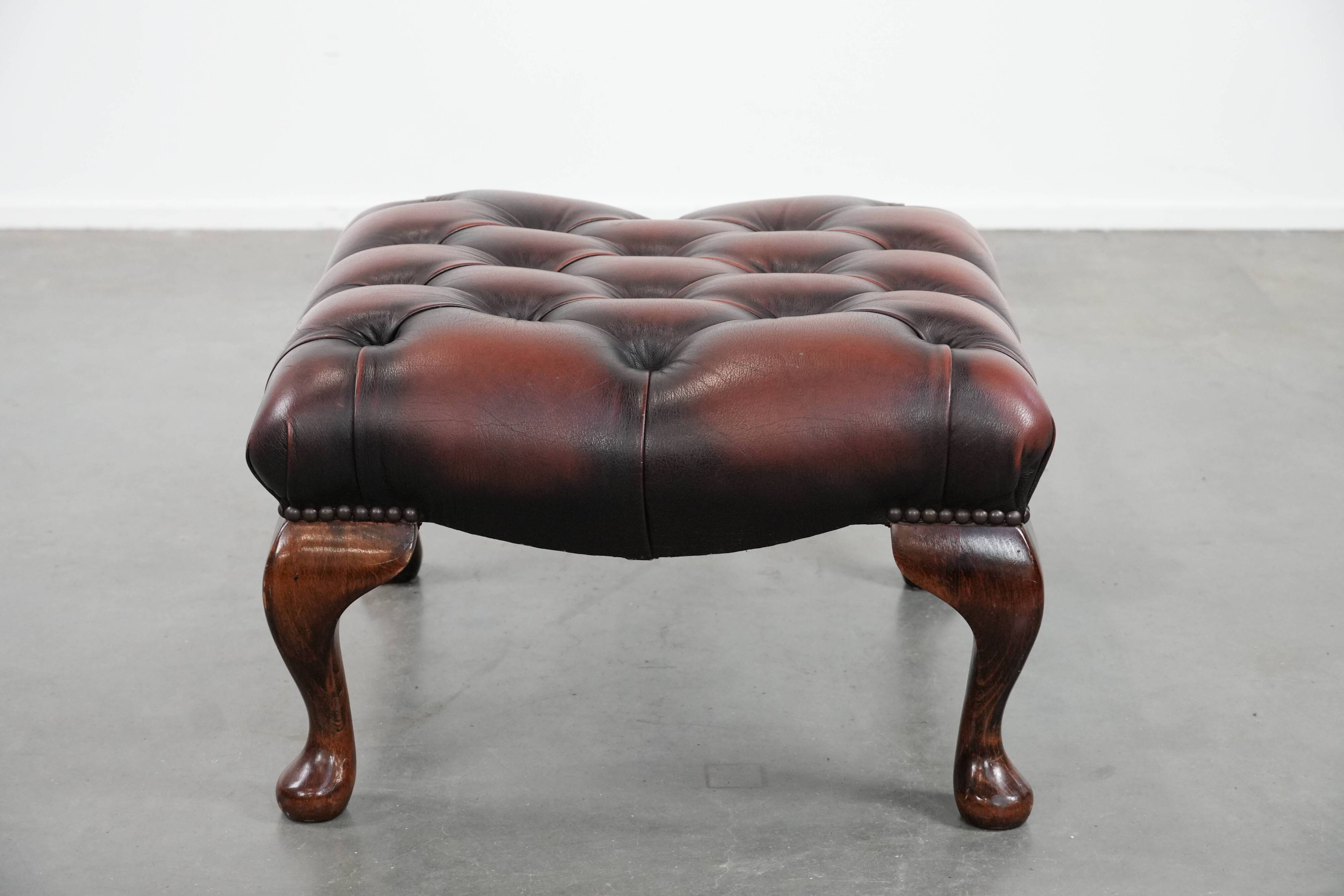 Dark brown chesterfield ottoman in cowhide leather
