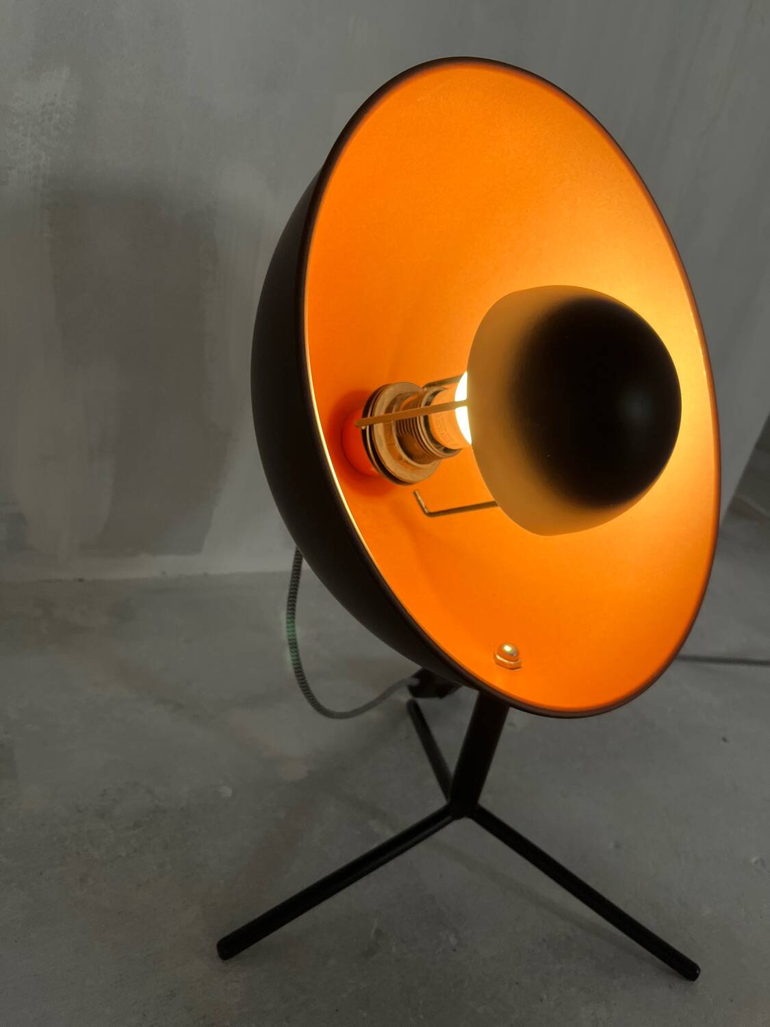 Vintage industrial lamp with a metal frame.