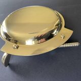 Round brass pocket tray with club and golf ball decoration.