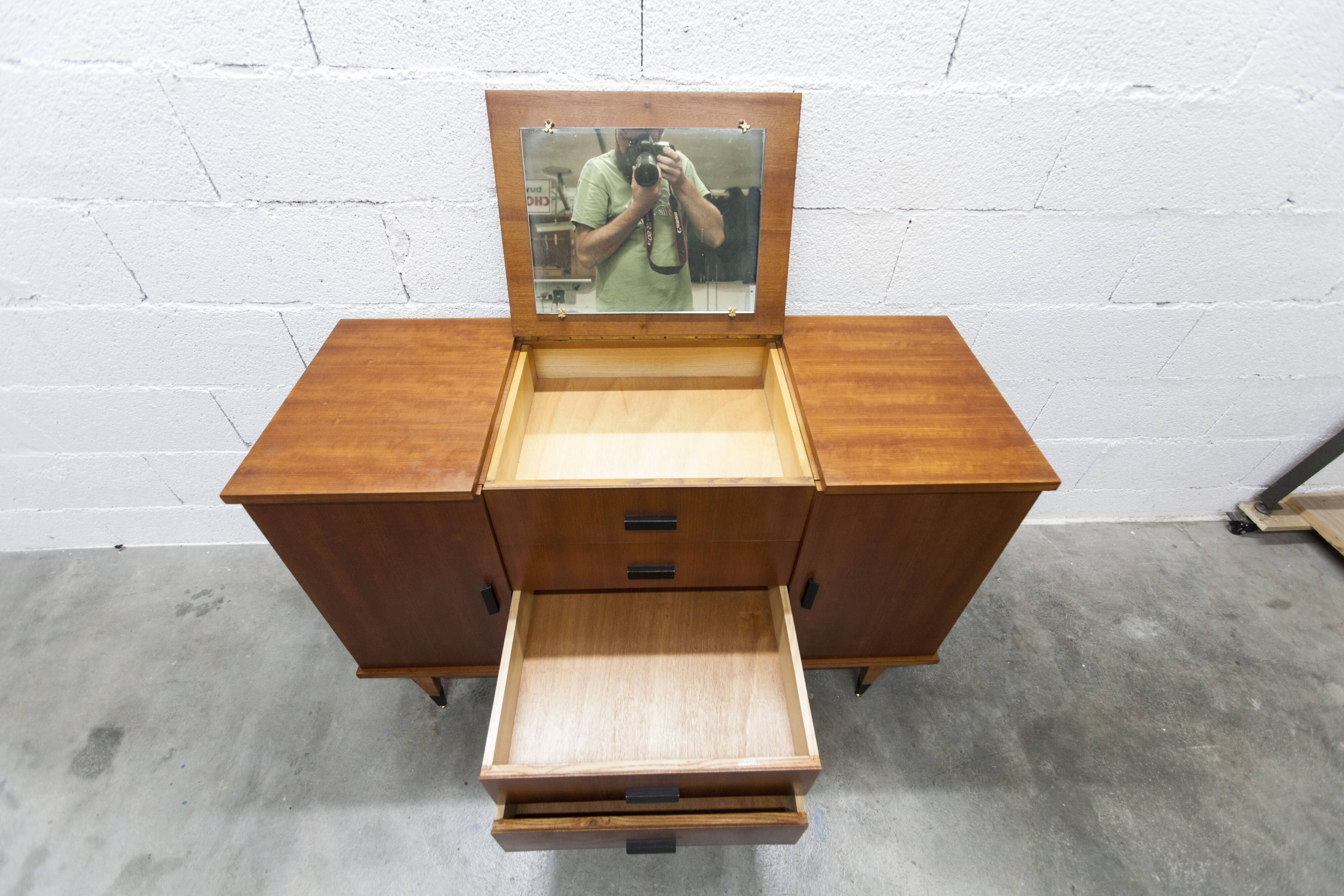 1960s teak sideboard with 4 drawers, 2 doors, and a mirror.