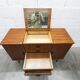 1960s teak sideboard with 4 drawers, 2 doors, and a mirror.