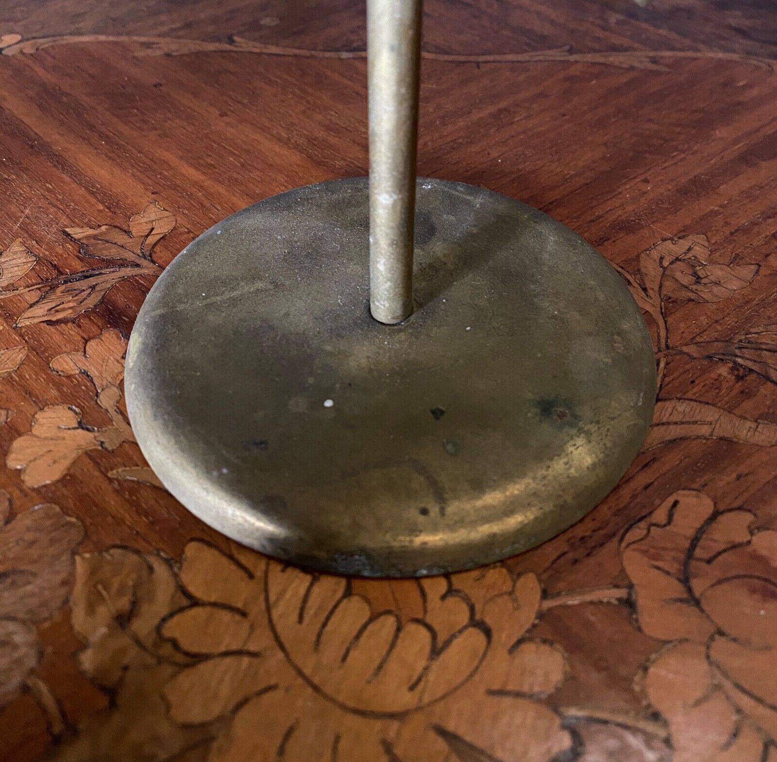 Pair of brass candlesticks decorated with 20th century stars