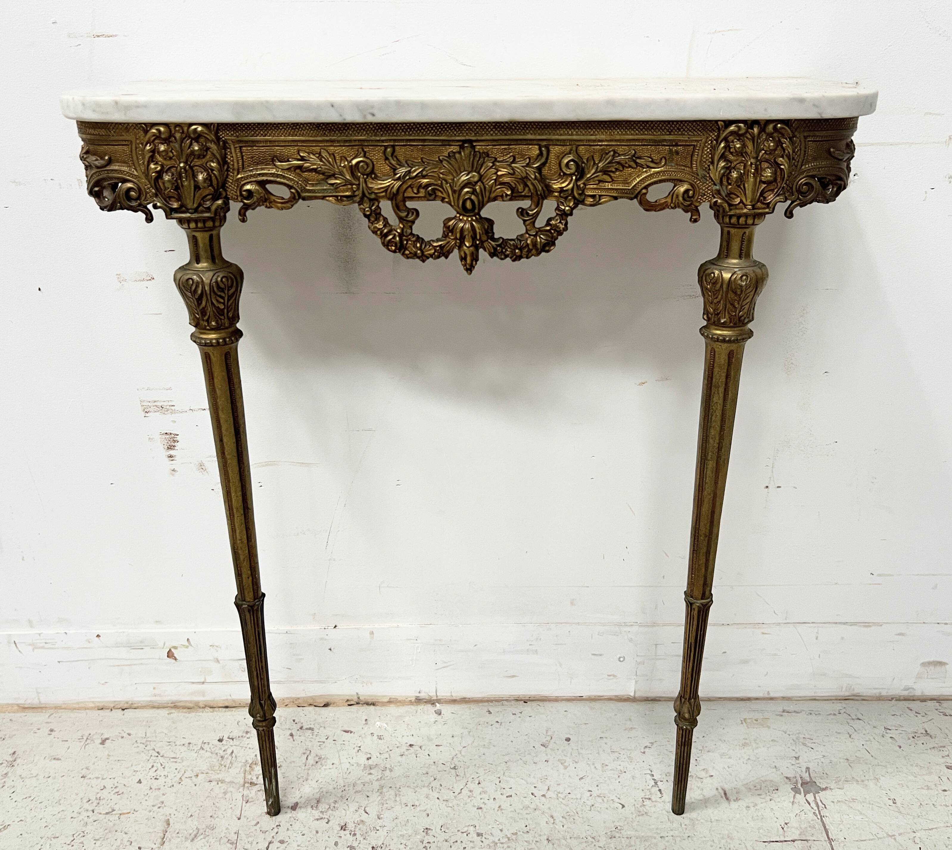 Louis XVI style console in chiselled bronze, 20th century.