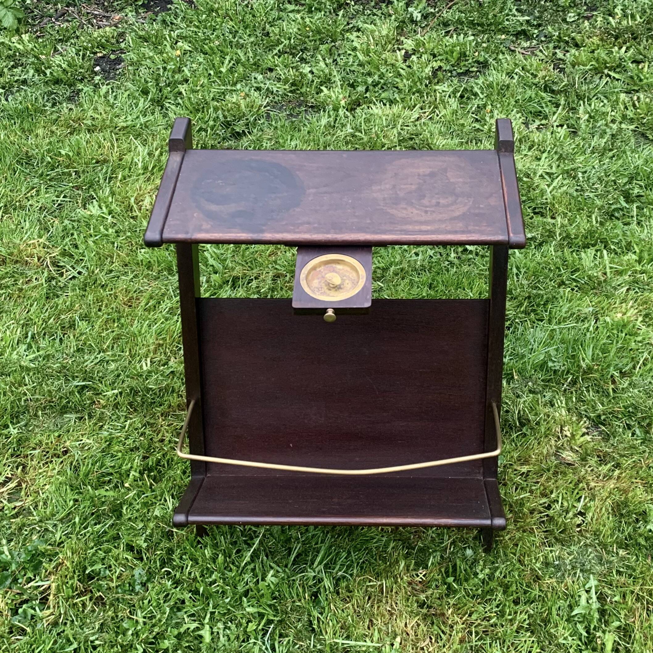 Old Scandinavian style magazine rack in dark wood with integrated brass ashtray