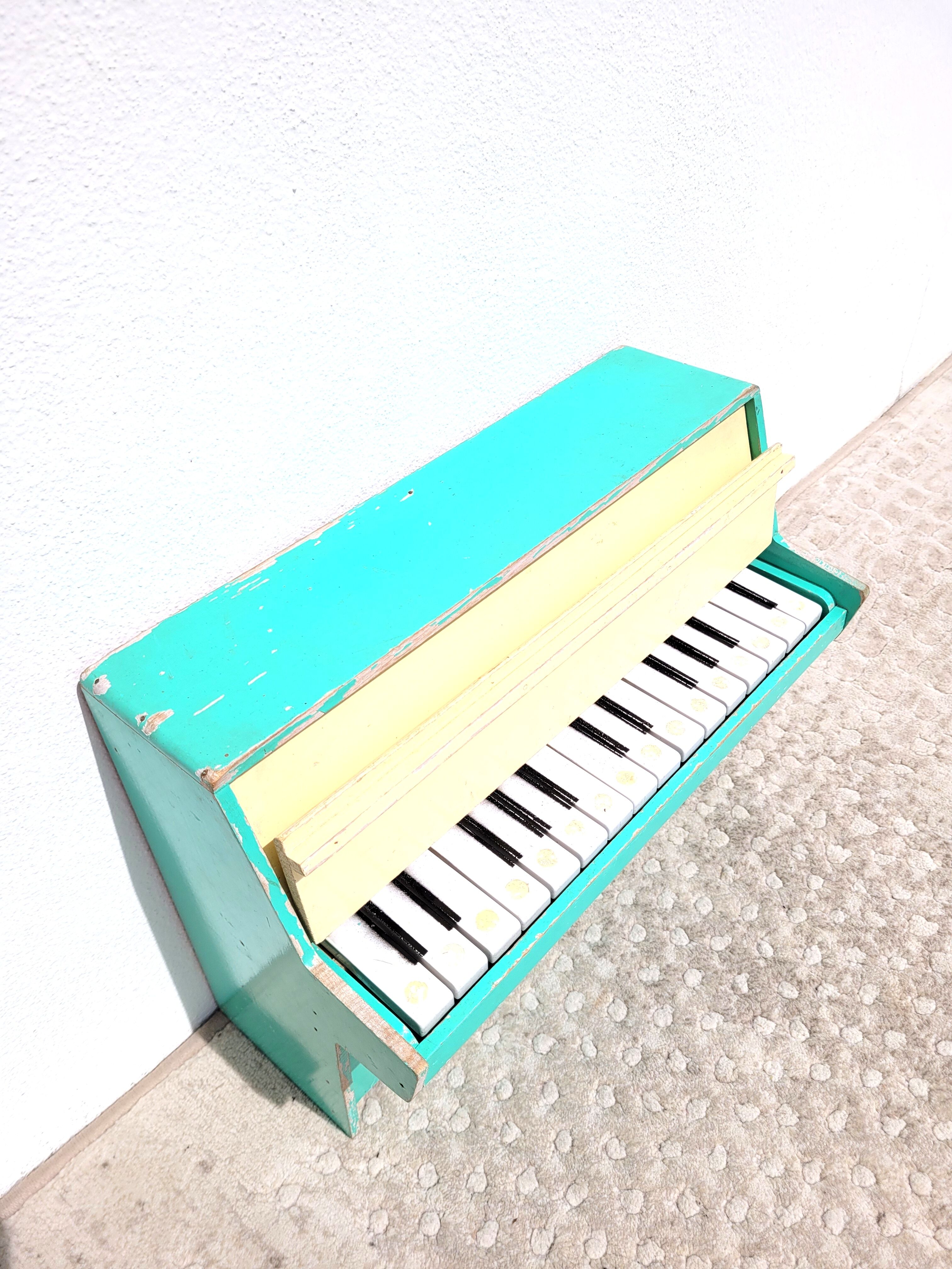 Miniature toy piano green 1950s