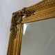 Miroir biseauté style empire doré 74x64cm