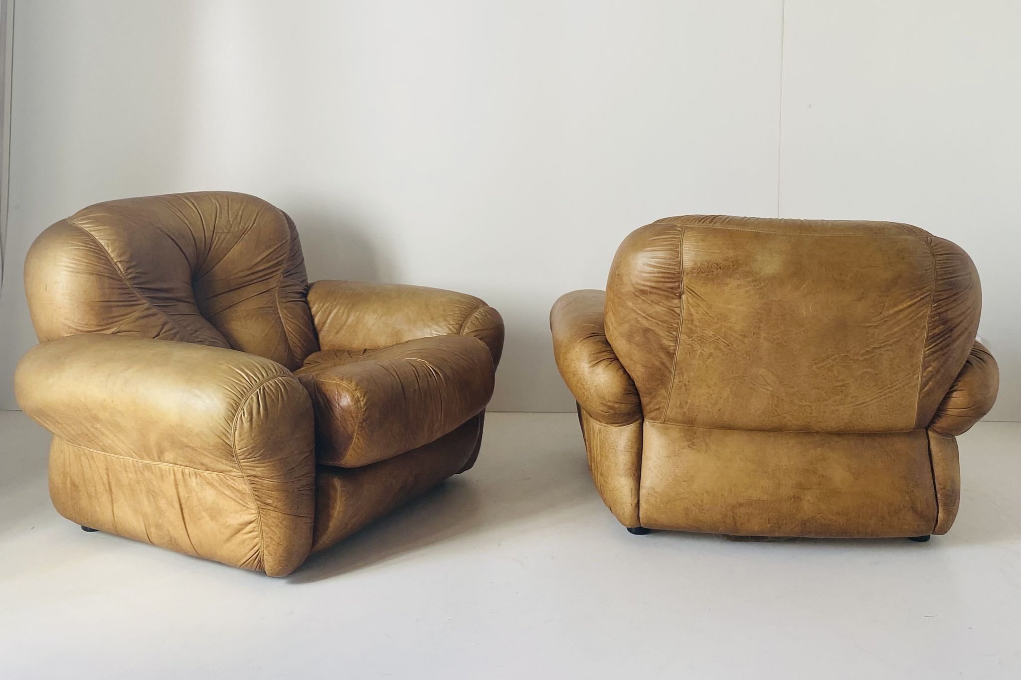 Pair of brown leather armchairs