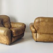Pair of brown leather armchairs