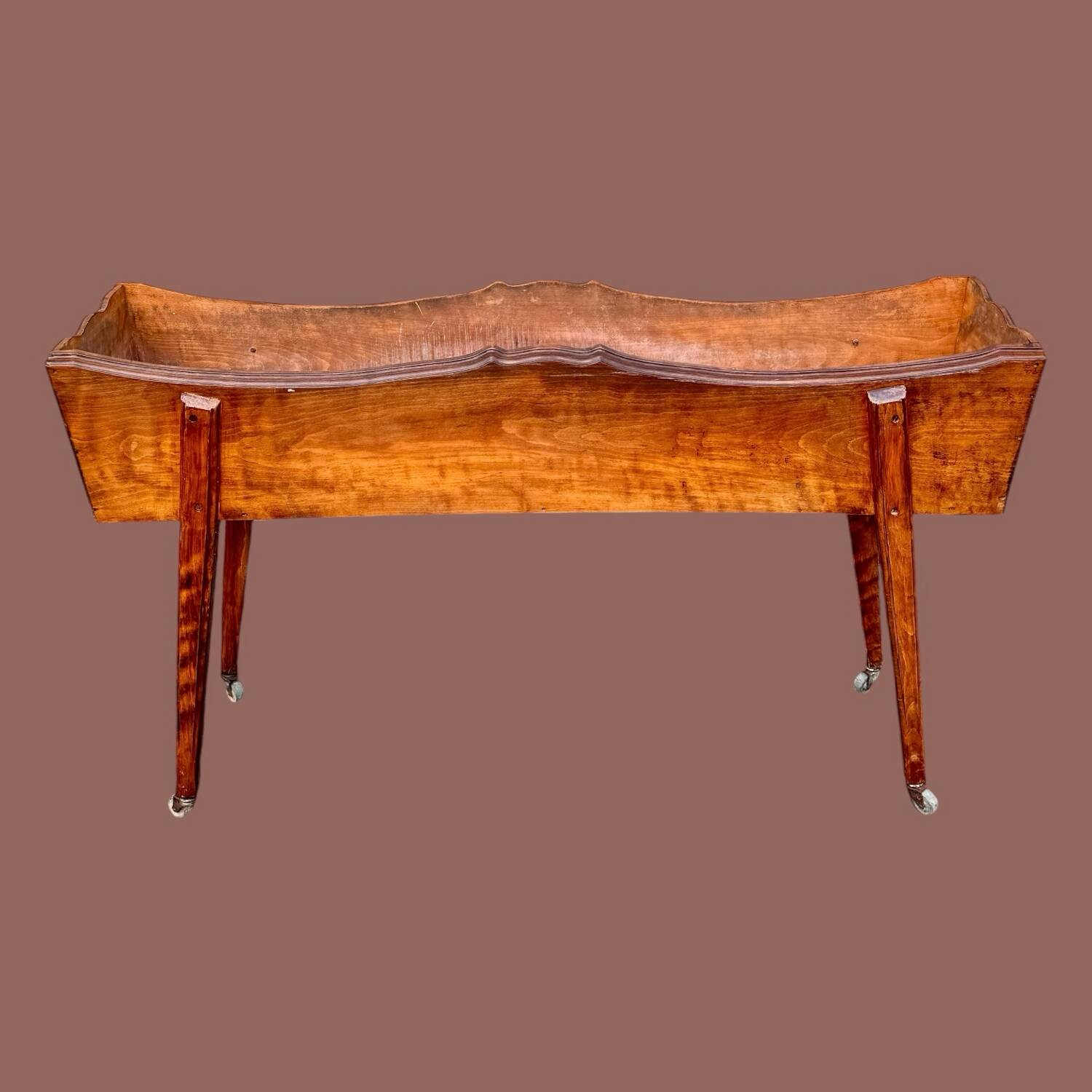 Old indoor planter on wheels