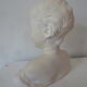 Bust young boy in plaster